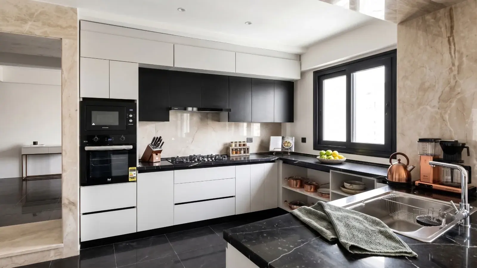White and black kitchen with marble worktops