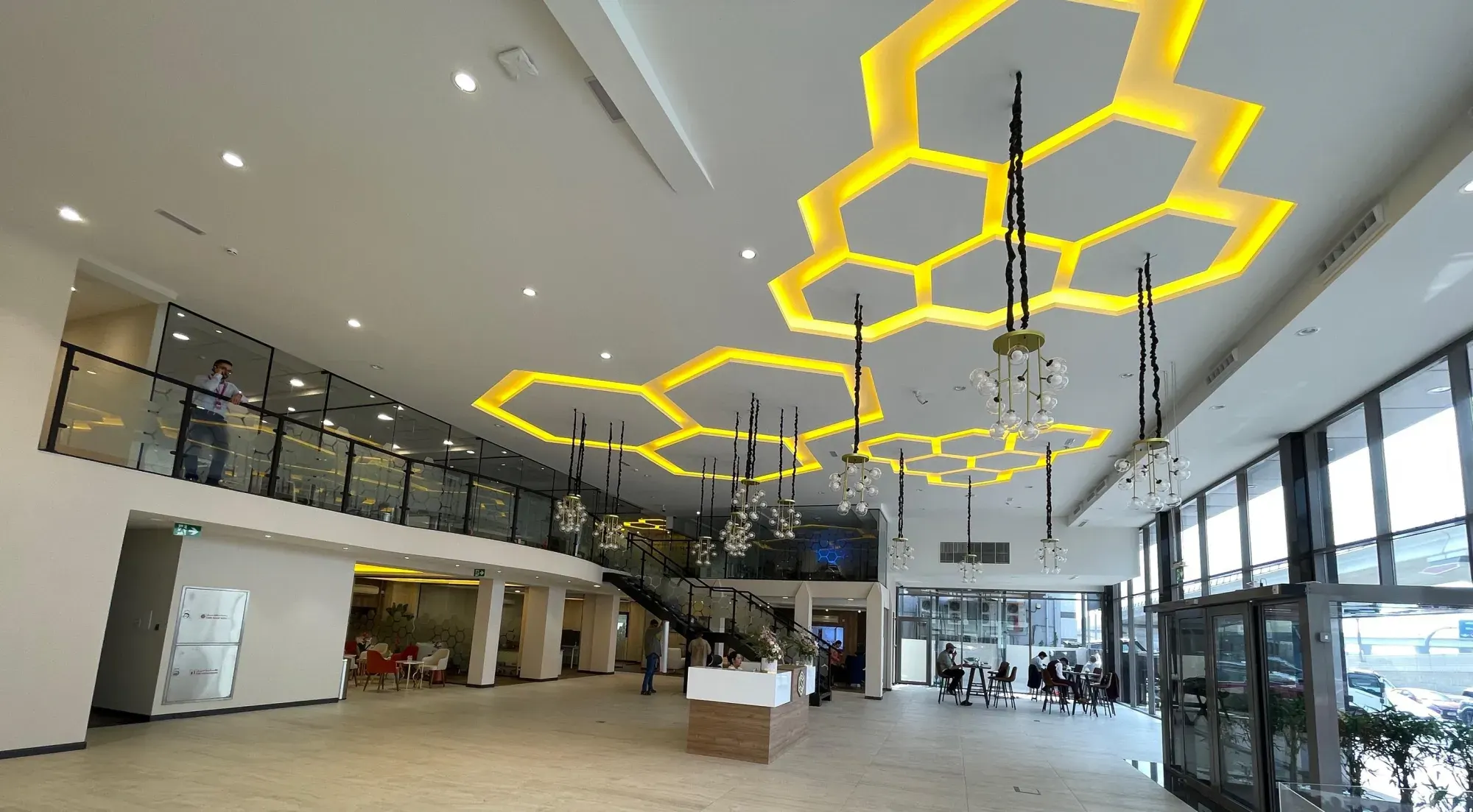 Office atrium with hexagonal illuminated ceiling